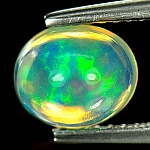 ok. 1,15ct/1szt. -NIEZRÓWNANY OPAL NAT.- unikat 8,10x6,76m / 4,71mm głęb. owal